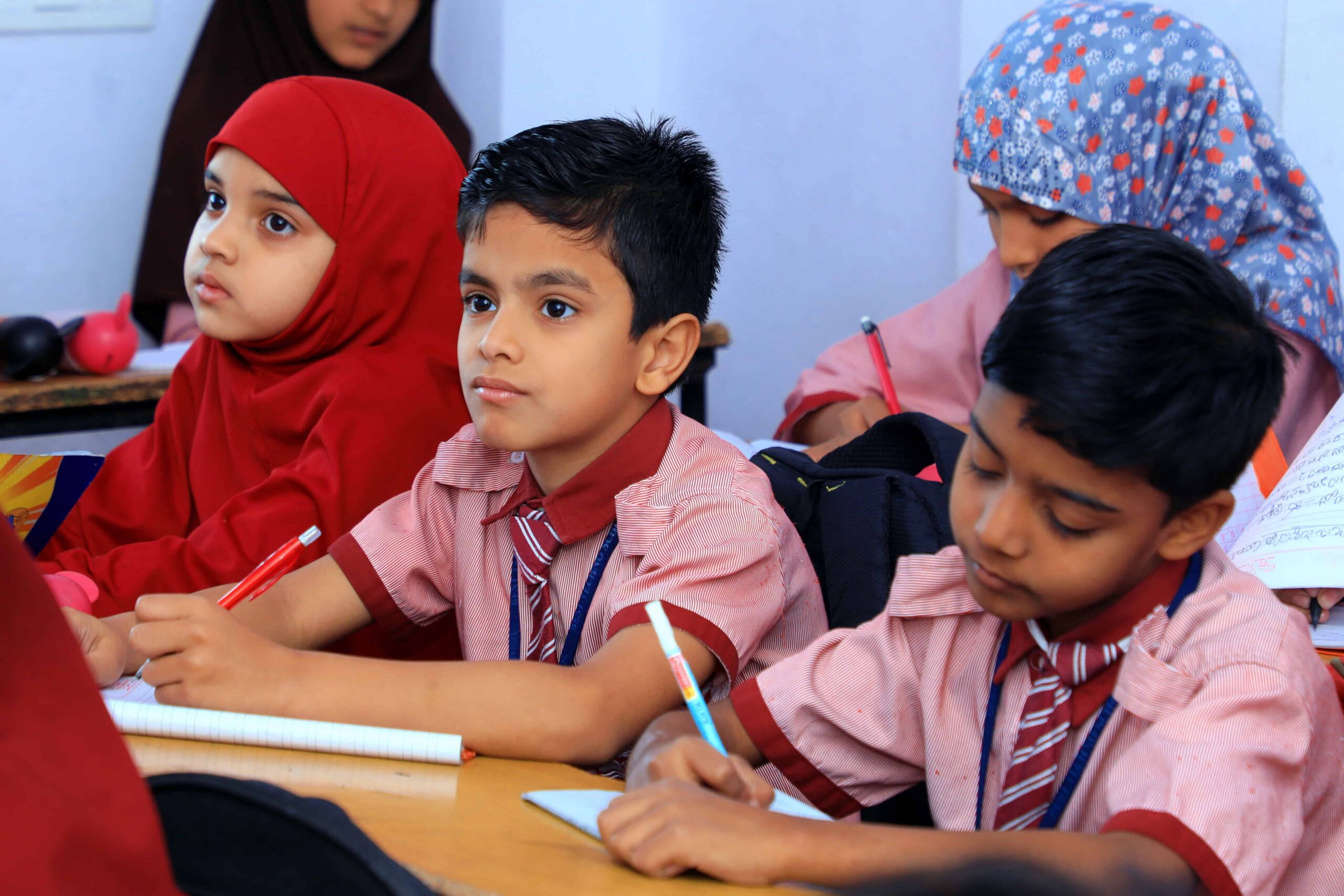 Students attentively studying in a classroom at Best Techno School, taking notes and participating in lessons under the SSC curriculum in a focused academic environment.